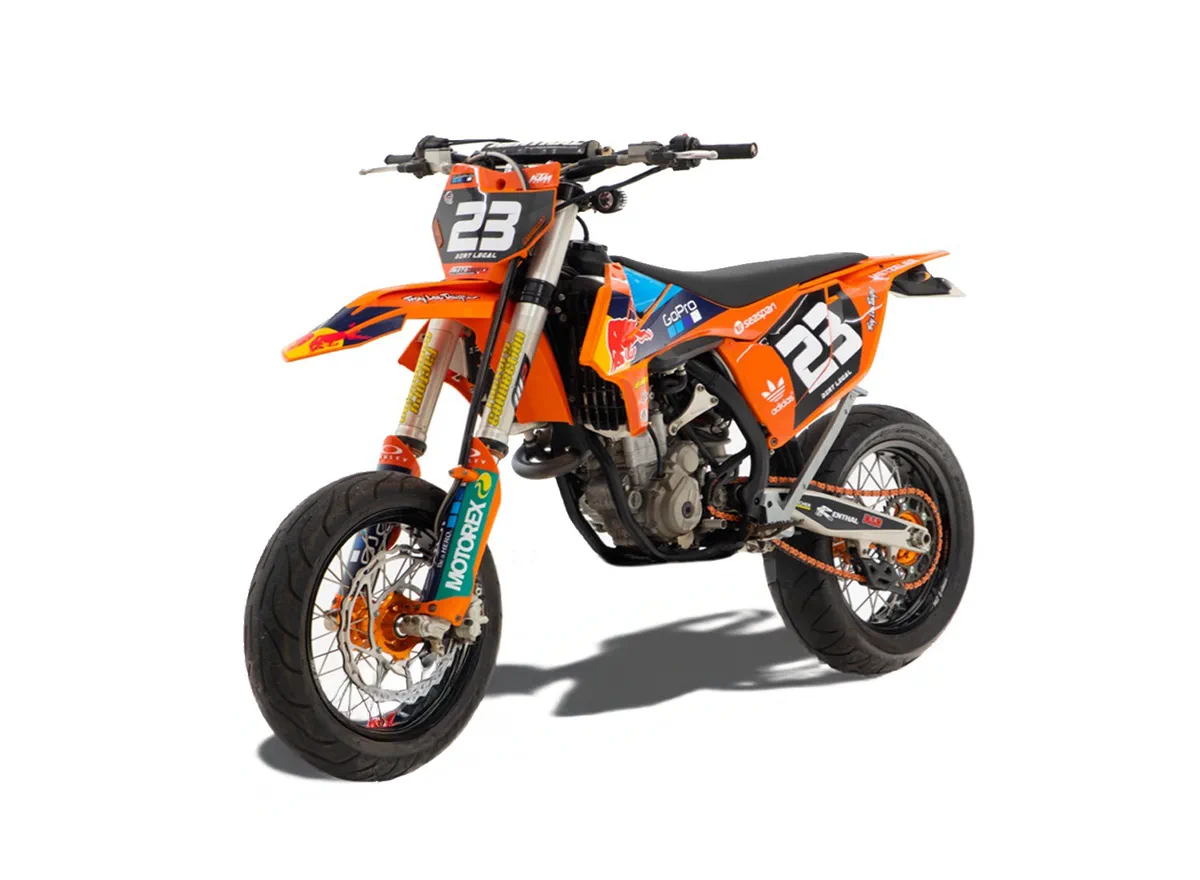 An orange KTM dirt bike with racing graphics and the number 23 on the front and sides, built for off-road and motocross riding.